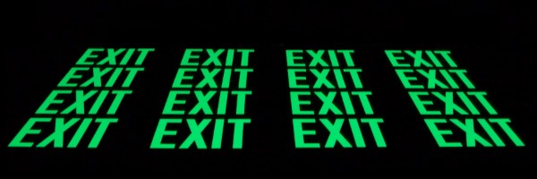 glowing exit signs arranged in rows